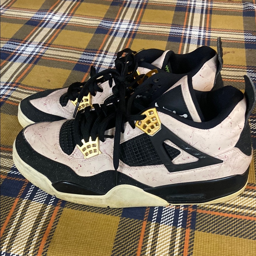 Jordan 4 Black and Cream Sneakers with Gold Accents
